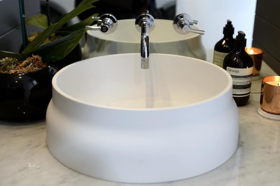 Dee's white sink in powder room