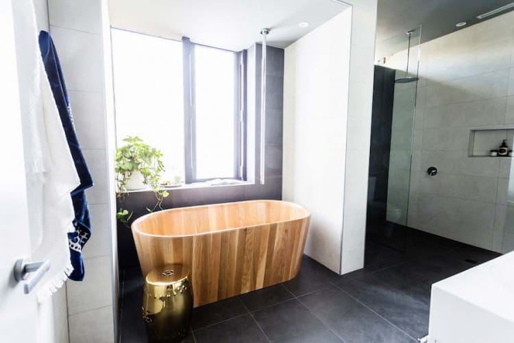 Wooden bath under window