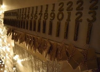 Advent calendar hanging over fireplace