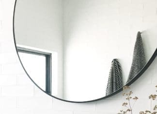 Bathroom vanity with round mirror
