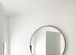 Round mirror in bathroom