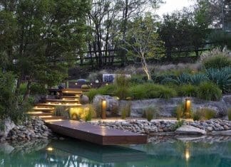 Tiered garden with wooden pontoon and lighting
