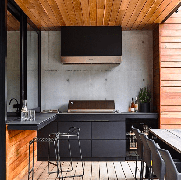 Concrete and black outdoor kitchen