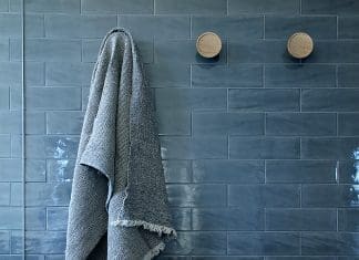 Dark blue subway tile bathroom