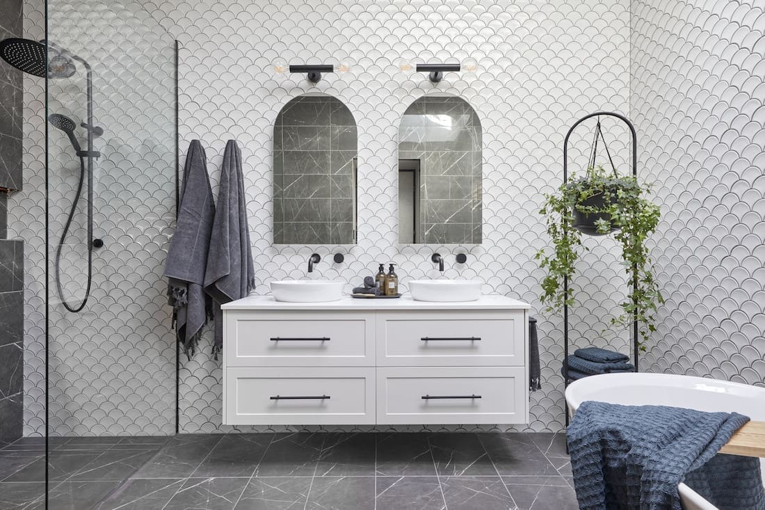 White fish scale bathroom with dark grey grout