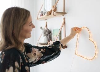 Placing DIY heart wall light in room