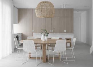 Basket pendant light over round dining table