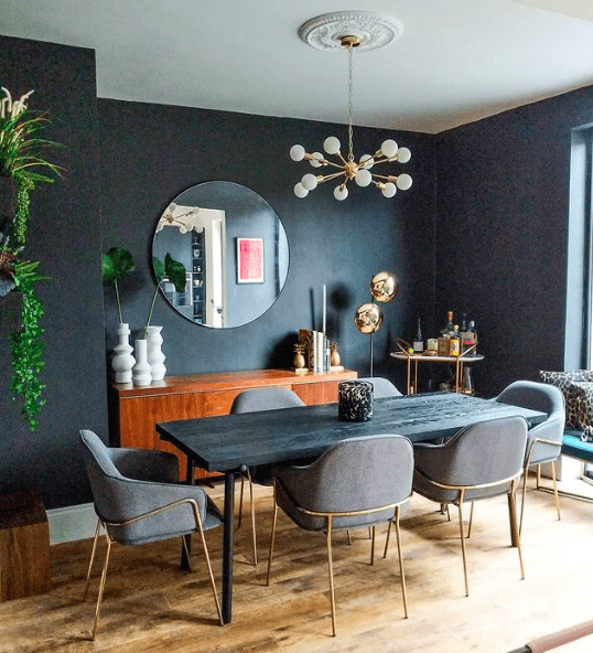 Black feature wall in eclectic vintage dining room