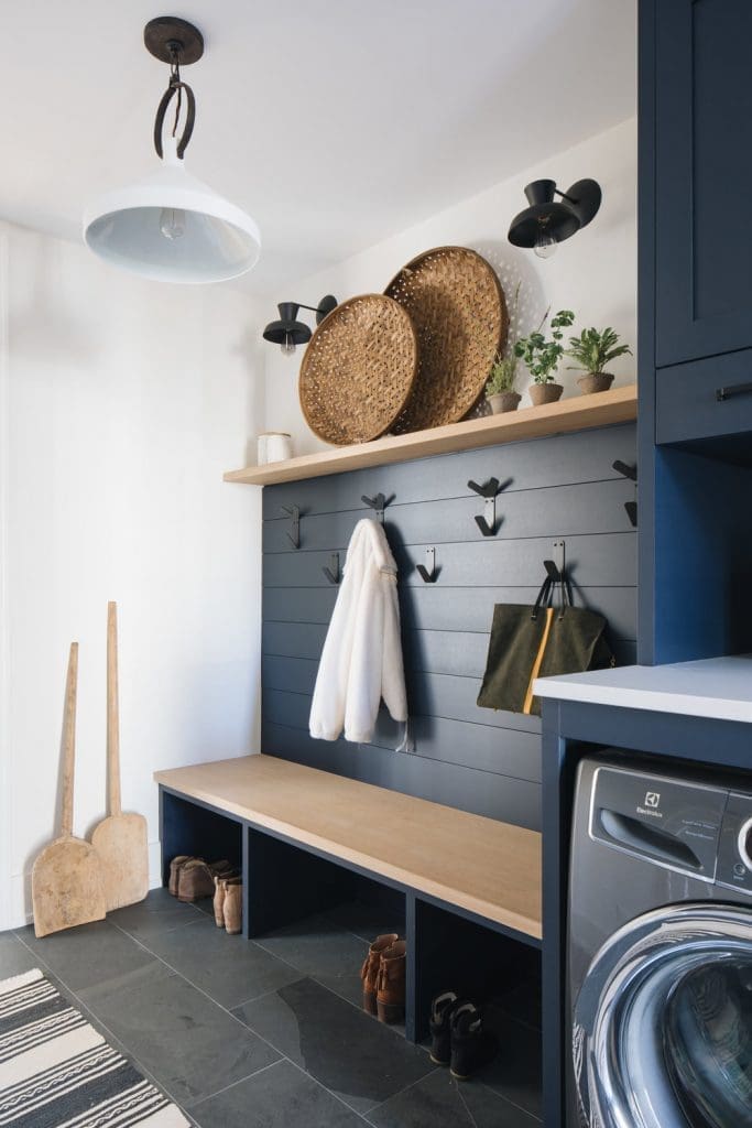 Dark panelled walls in laundry mudroom