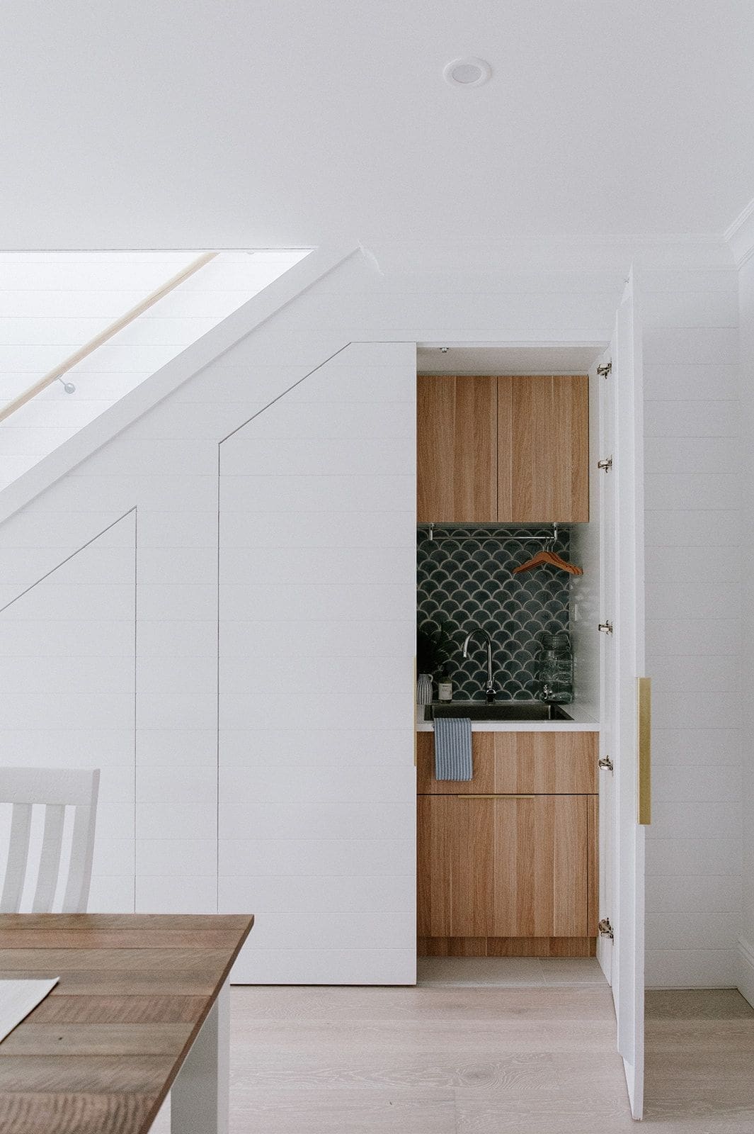 Under-stair laundry with door open