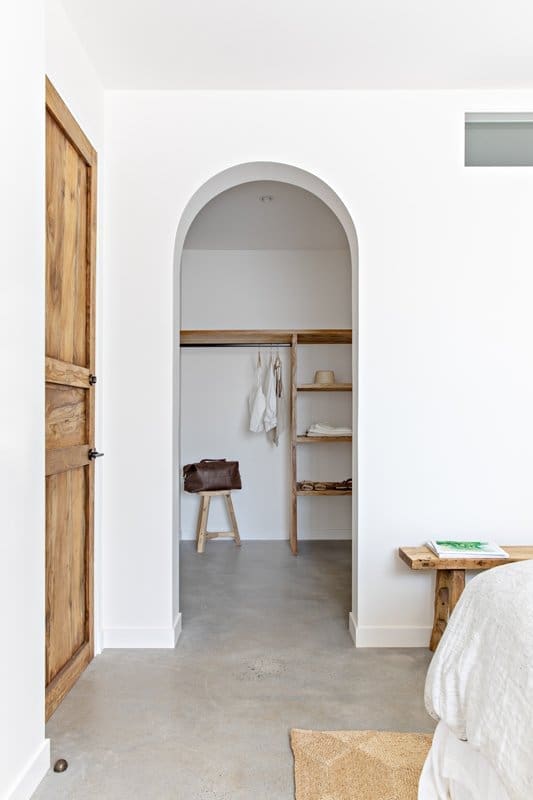 Curved doorway in bedroom