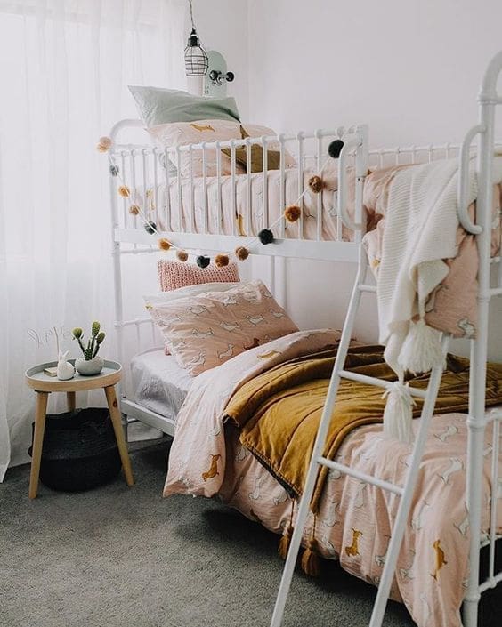 Bunk beds with pompom garland
