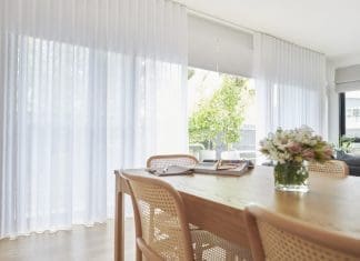 Sheer curtains over roller blind