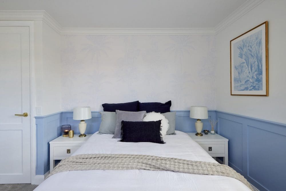 Subtle blue wallpaper in Hamptons style bedroom