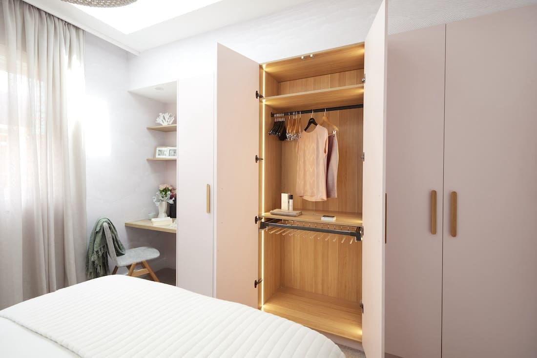 Guest bedroom with blush and timber wardrobe
