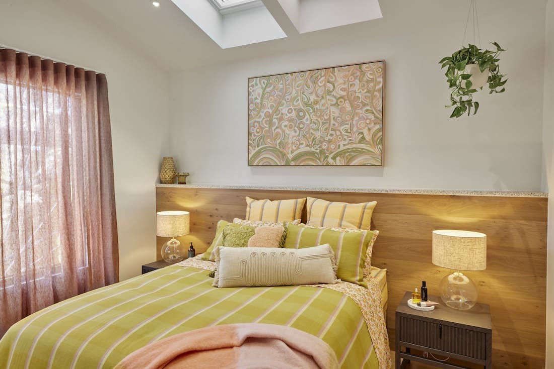 Guest bedroom in green and blush tones