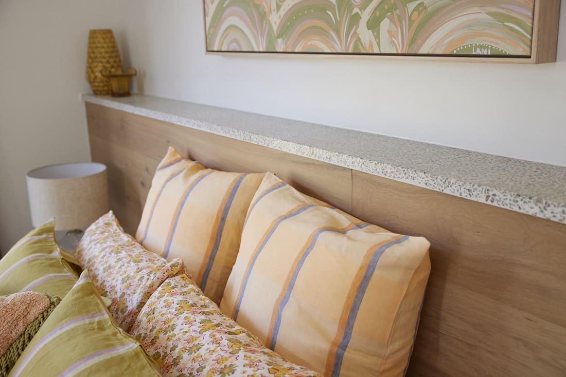 Apricot striped cushions with floral and terrazzo