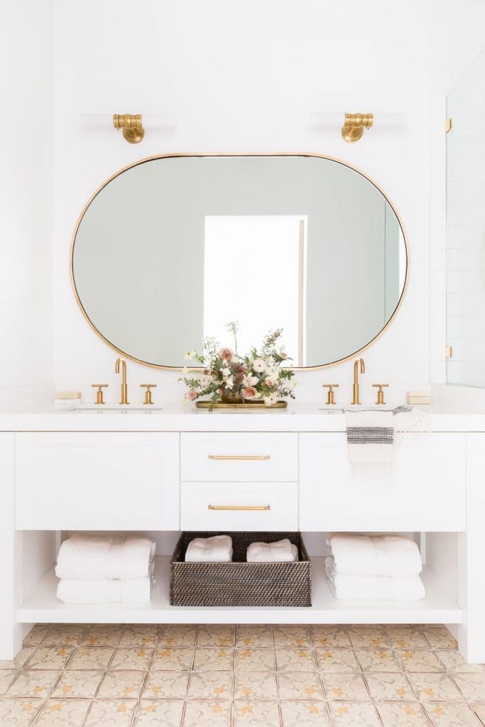 Gold oval mirror on its side what bathroom mirror to buy