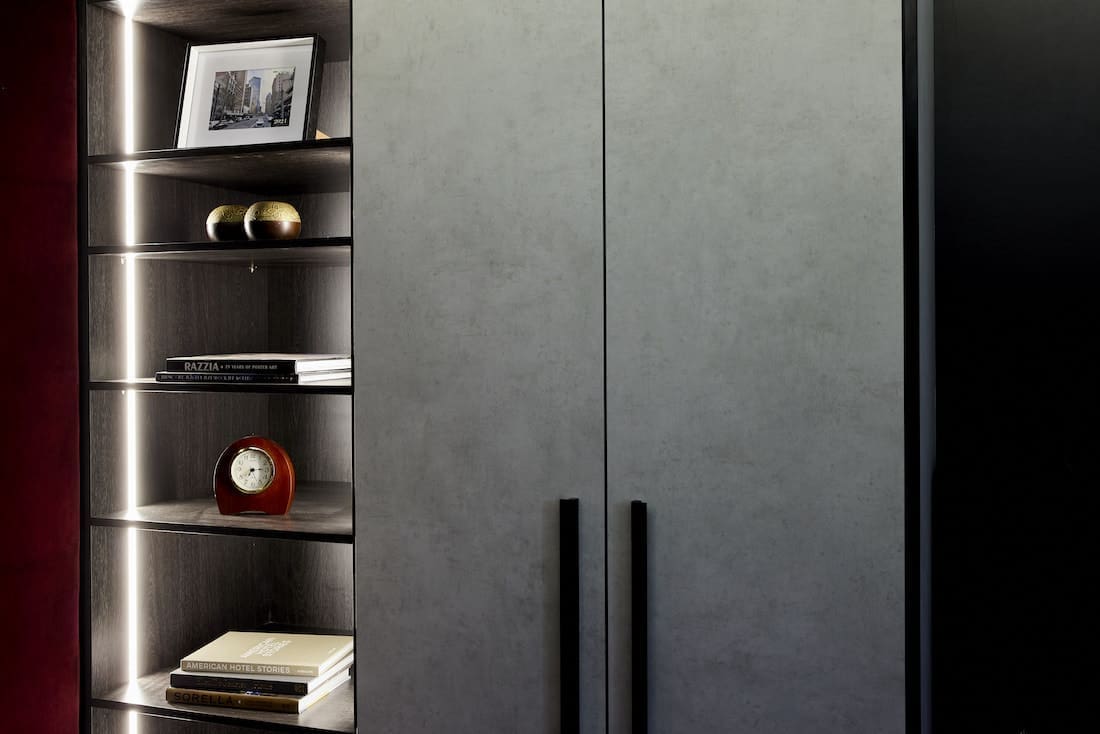 Glass cabinetry and grey storage