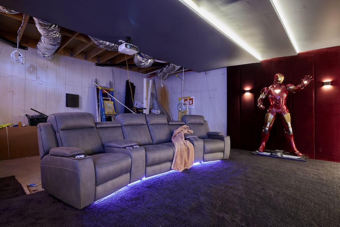 Life-sized Ironman sculpture in unfinished home cinema
