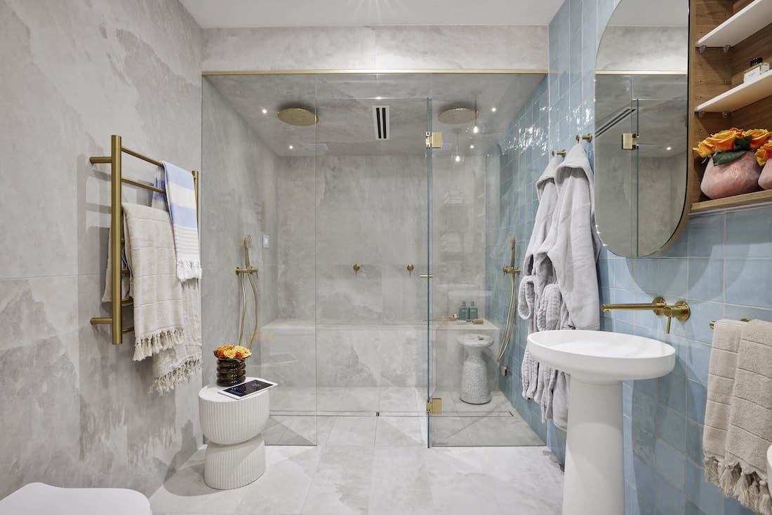Basement steam room with grey built-in seat