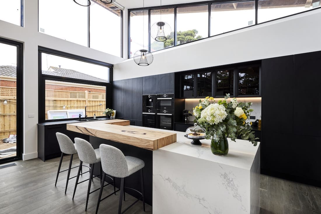 Stone benchtop with timber breakfast bar