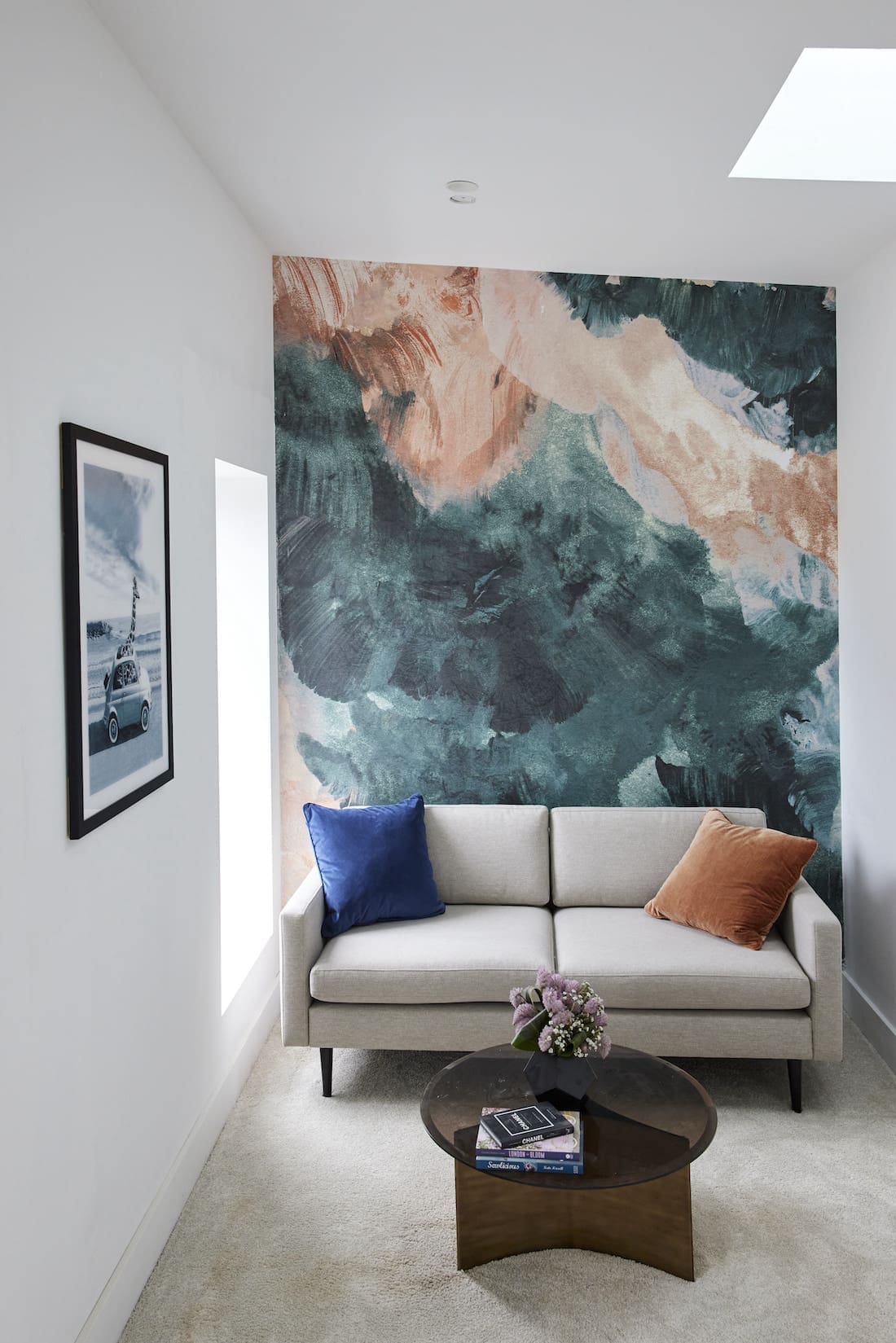 Artwork behind couch in study