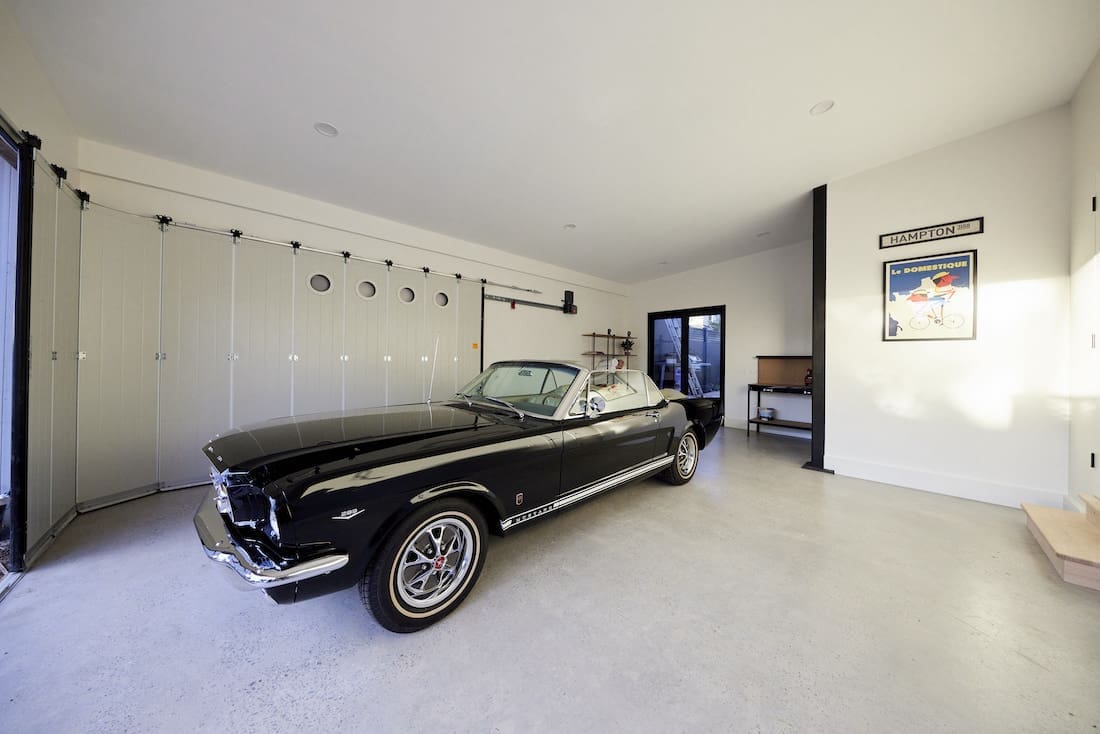 Black vintage mustang in polished concrete garage
