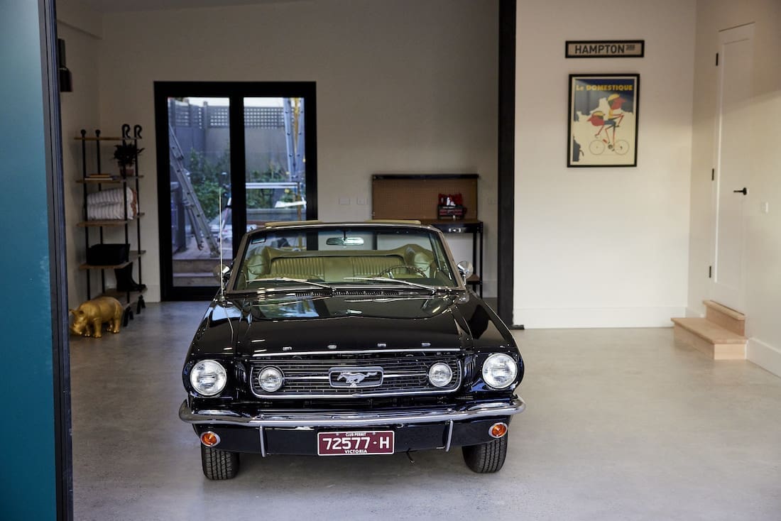 Black vintage mustang in garage