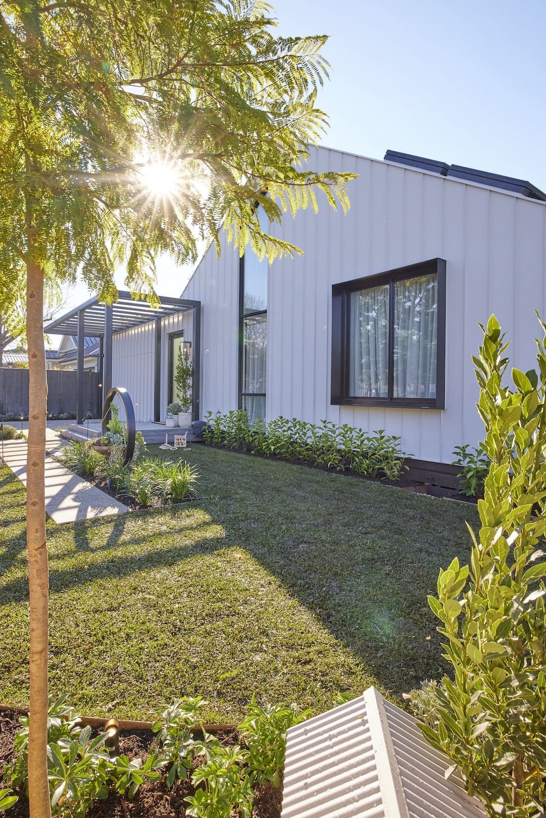 Grass and garden bed in front garden