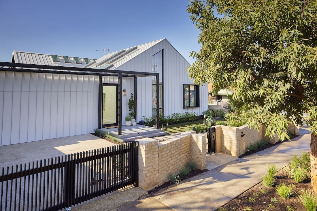 Brick fence and colorbond clad house exterior
