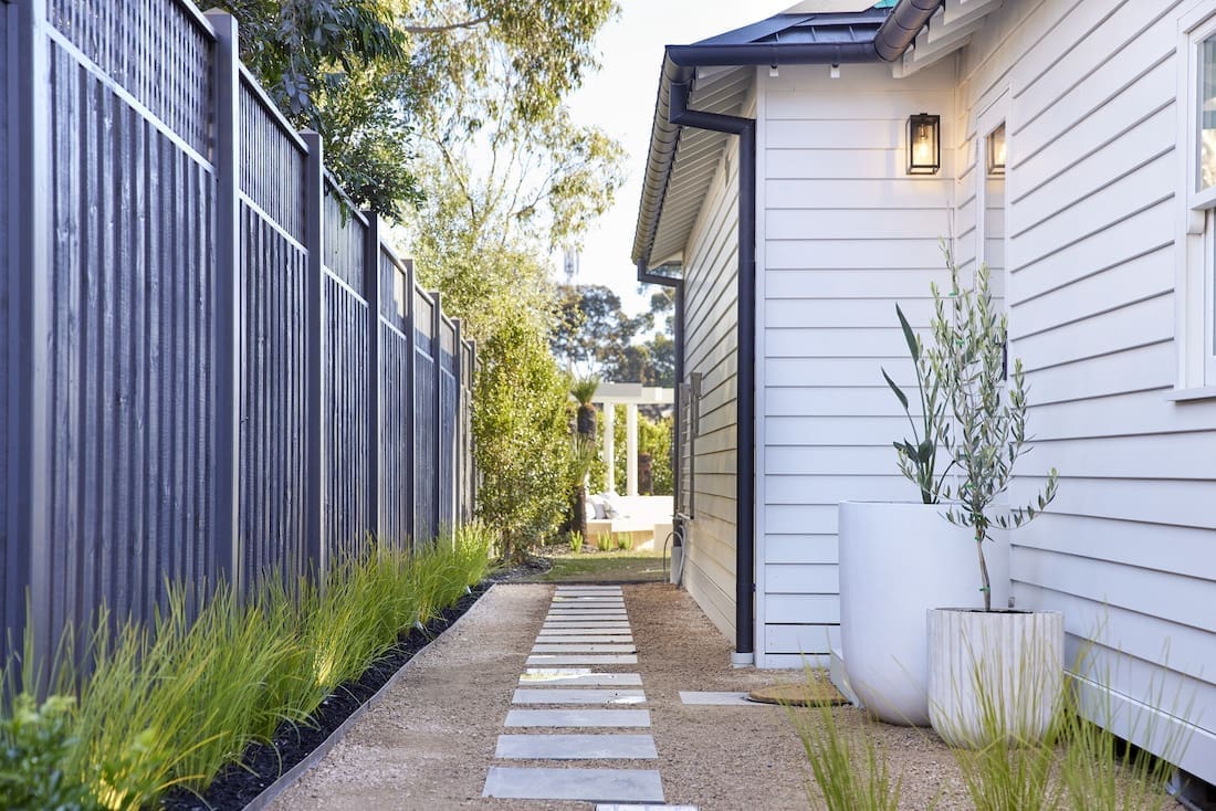 Side of home with stepping stone pavers