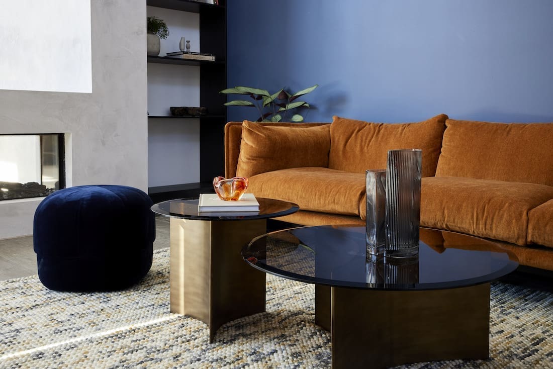 Tobacco coloured sofa with black and navy furnishings