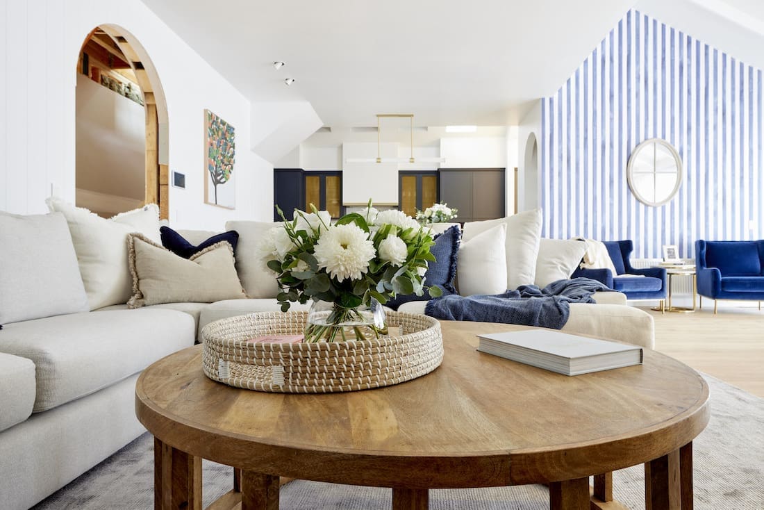 Rattan tray on coffee table with blue striped wall