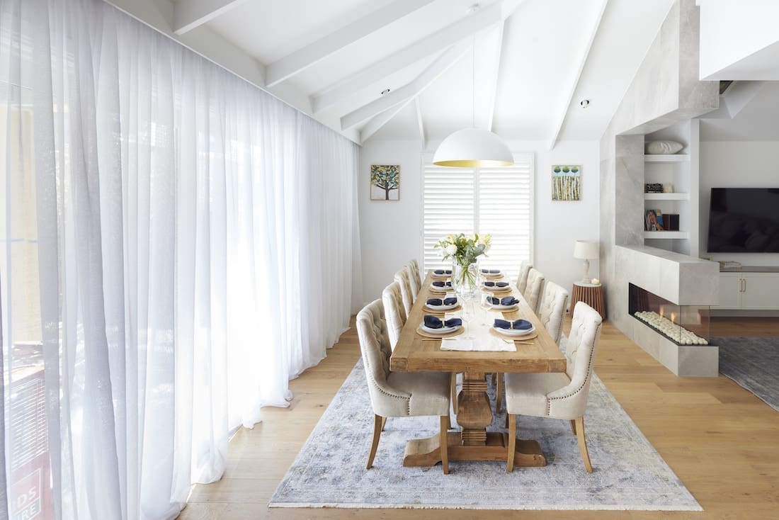 Dining room with extra long table and raked ceiling