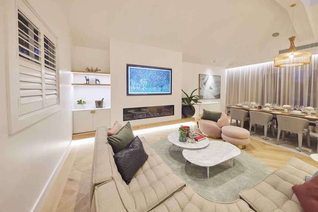 Living room with shelving space and dining room