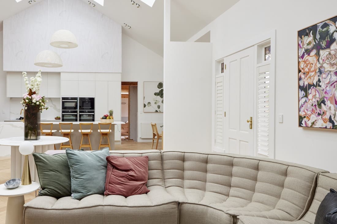 Curved sofa with view to kitchen