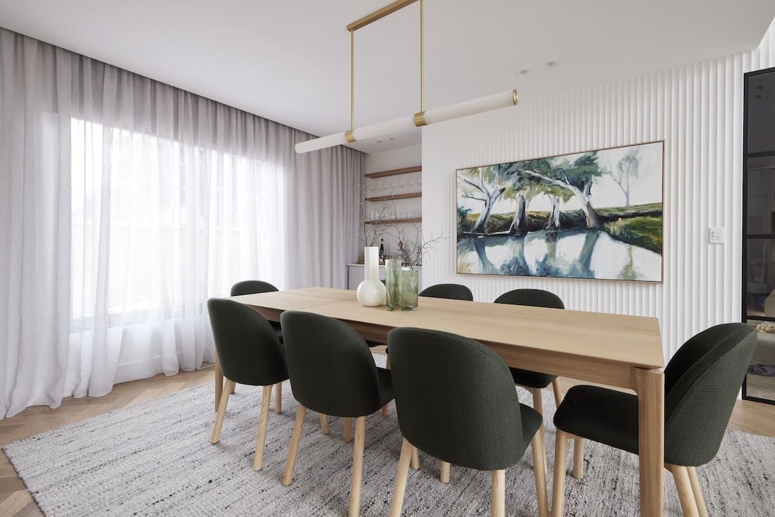 Dining room with olive green chairs