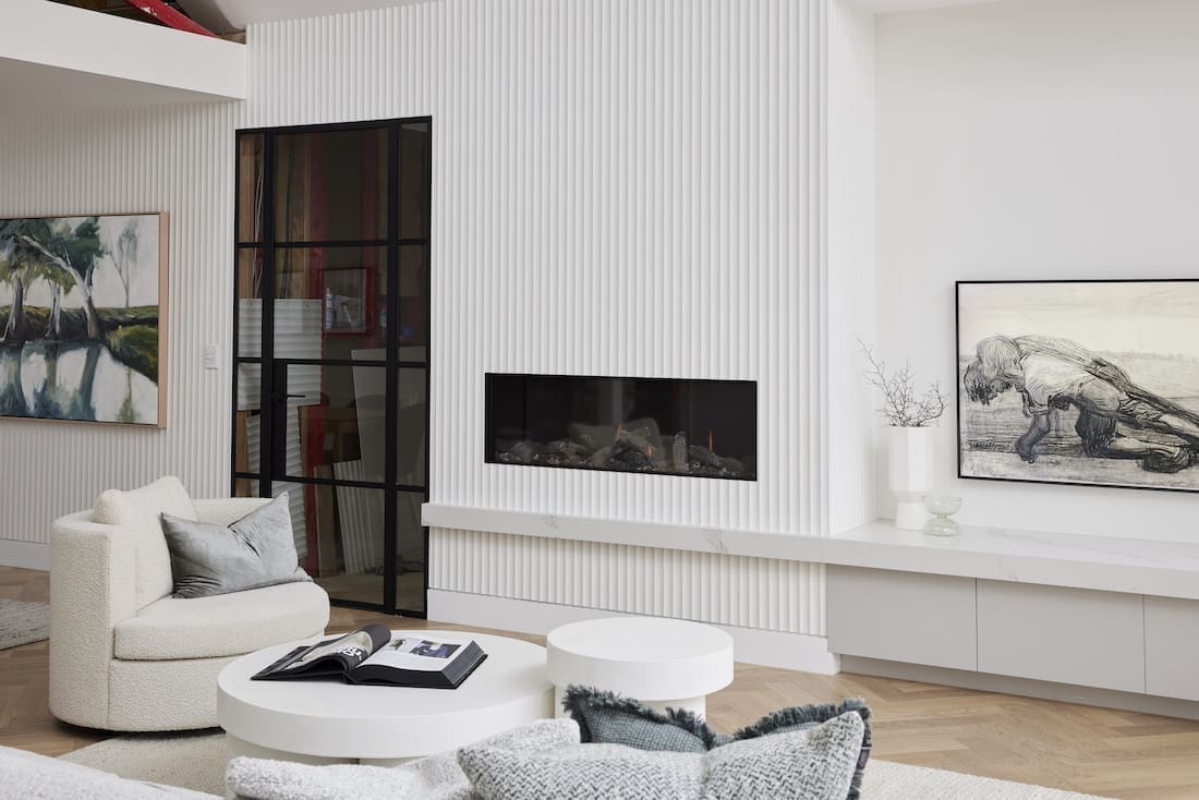 Scalloped wall detail around fireplace