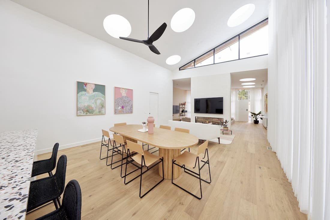 Round skylights over dining room with timber flooring