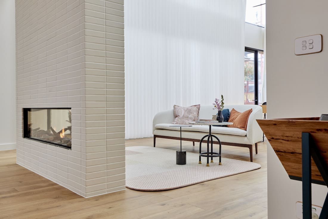 Double sided white brick fireplace
