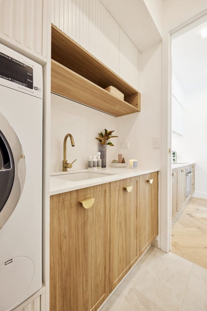 Laundry with timber cabinetry and open shelf