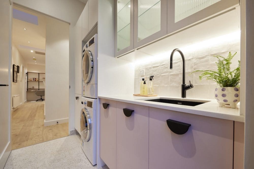 Pink cabinetry in laundry