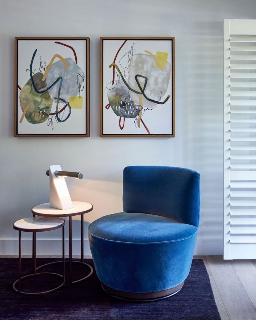 Seating space with blue velvet occasional chair