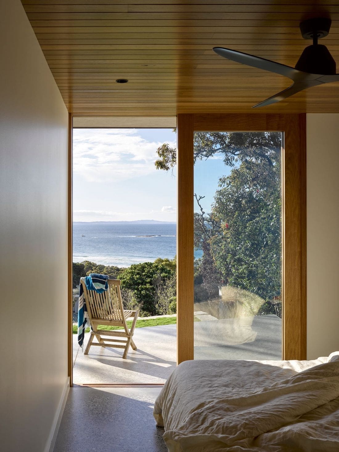 Bedroom to patio with view of ocean
