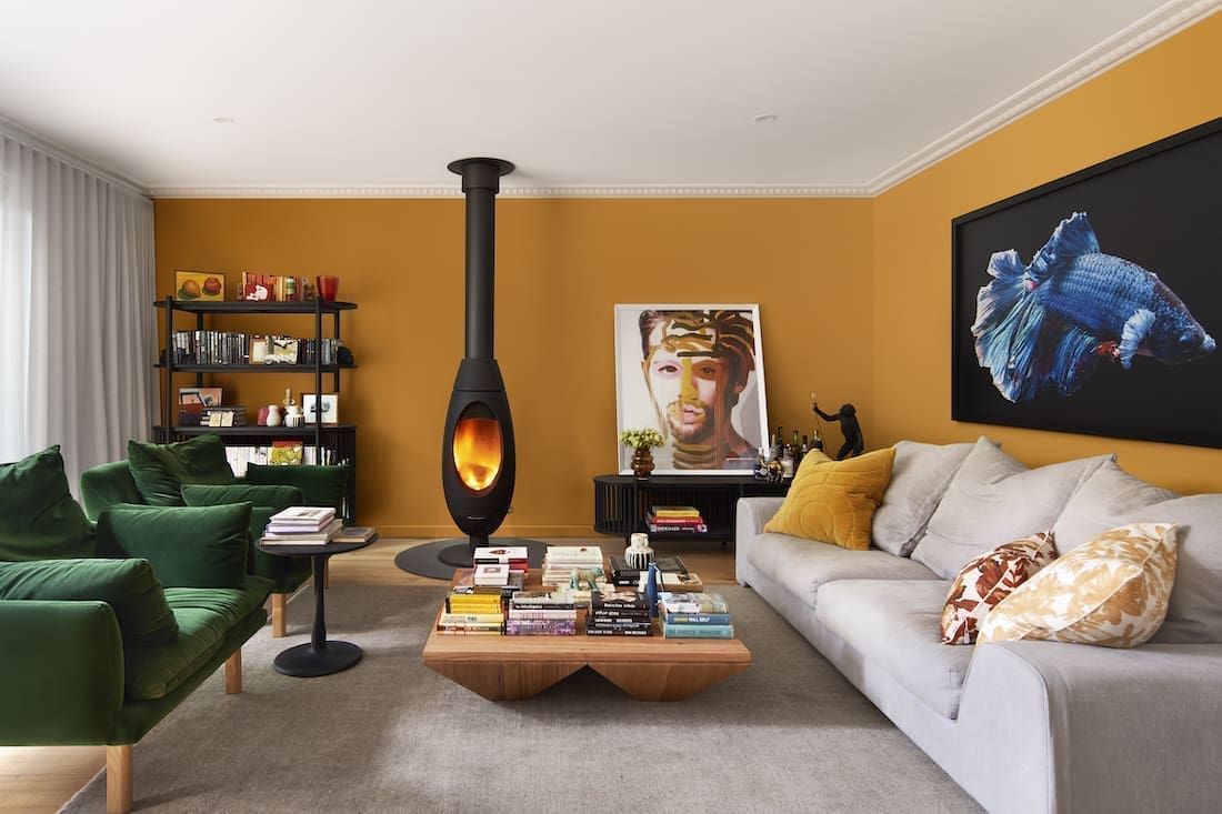 Mustard yellow living room with unique fireplace