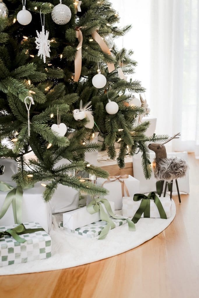 Stamped gift wrap presents under tree