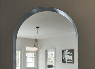 Archway leading into living room