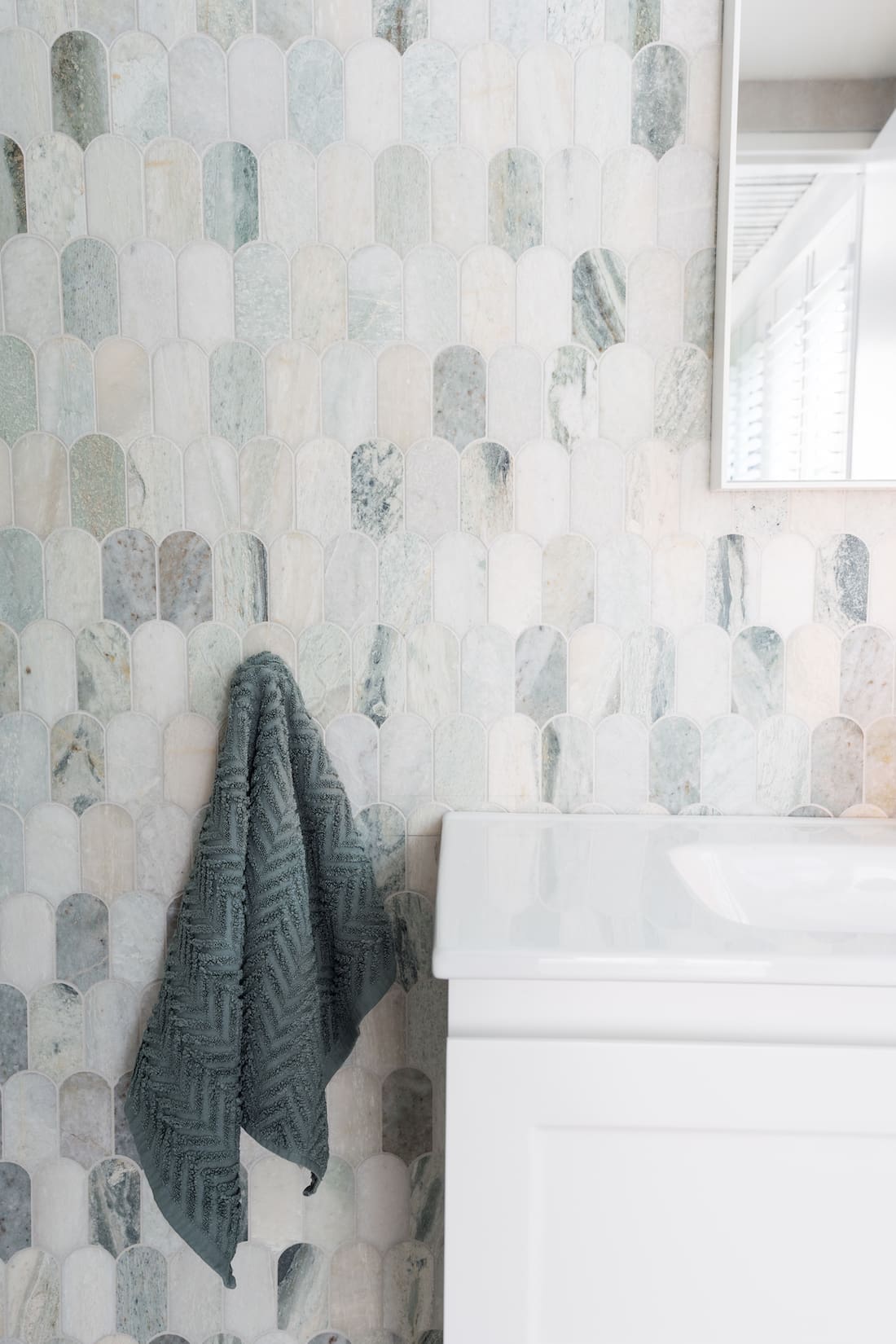 ming green long fishtail tile with white shaker style vanity