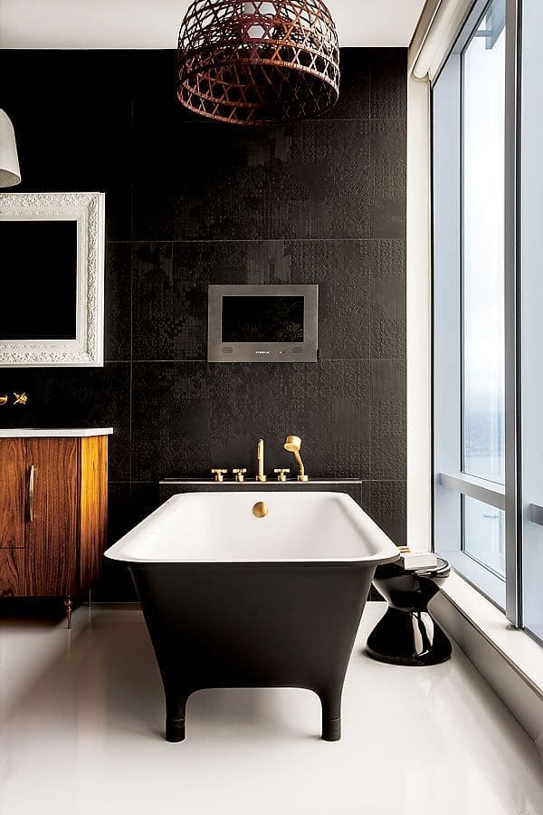 Black bathroom with black bath